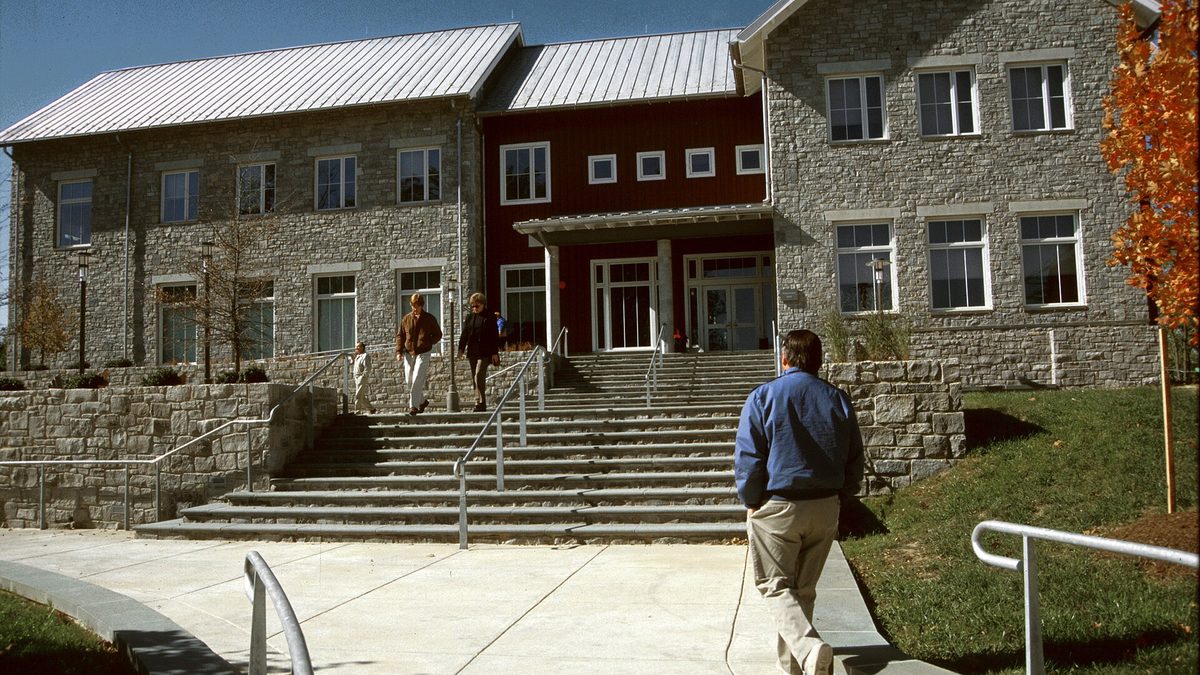 Students walking across a college campus
