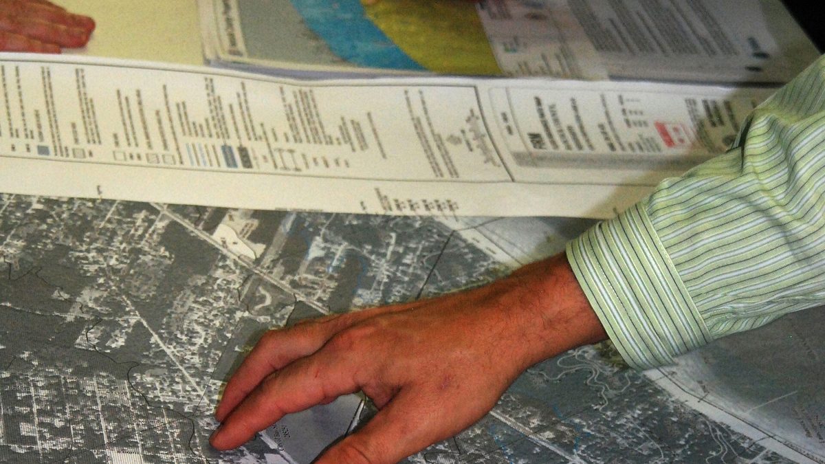 Residents looking at new flood maps at an open house